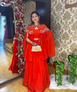 STUNNING ORANGE SKIRT BUSTER WITH DRAMATIC CAPE