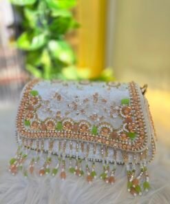 SITARA IVORY GOLD HANDWORK BAG WITH TASSELS